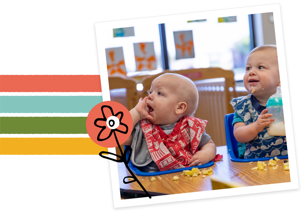 infants wearing bibs smiling and eating