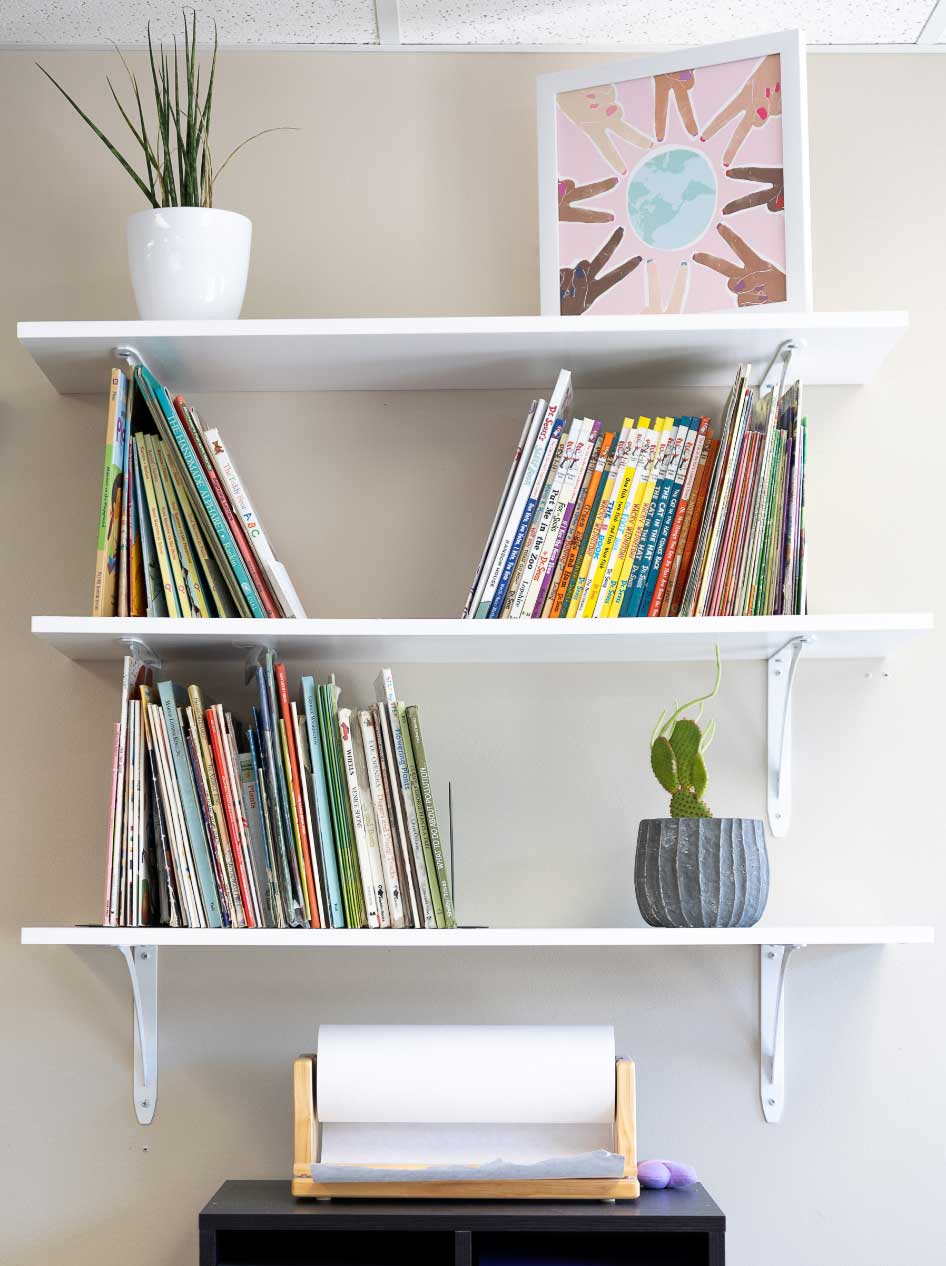 pre-k room with shelf of books